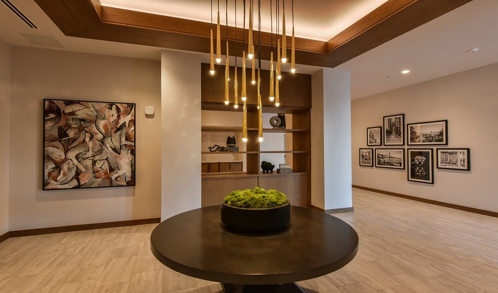 a dining room with a table and a chandelier