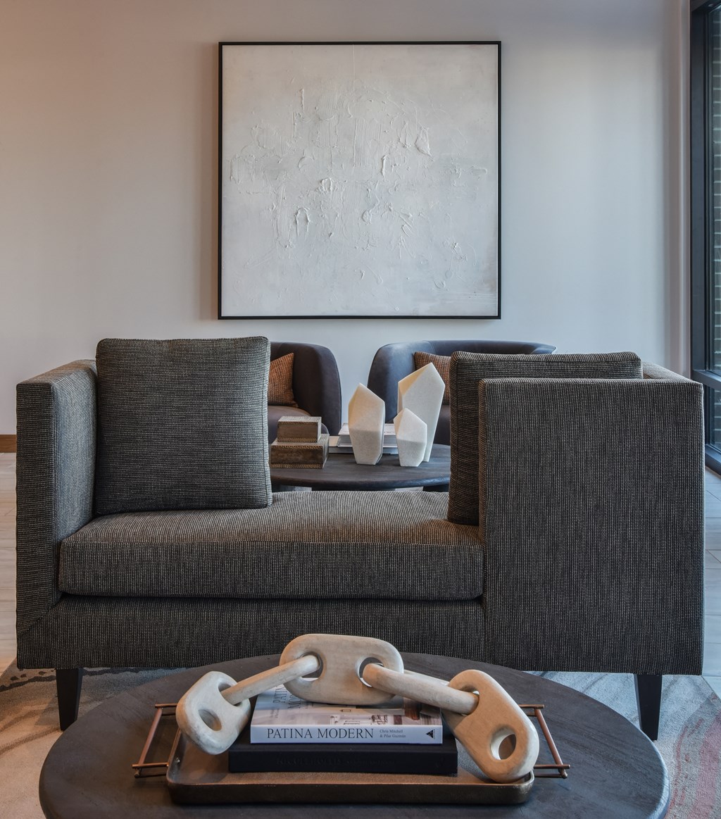 a living room filled with furniture and a large window