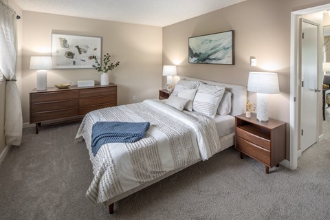 Bedroom with a bed and two nightstands and a closet at Summerfield, Tigard, OR, 97224