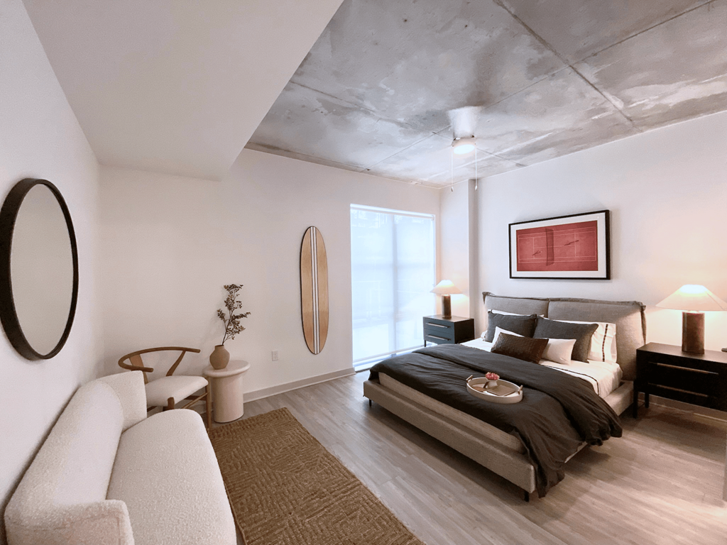 a bedroom with a bed and a couch