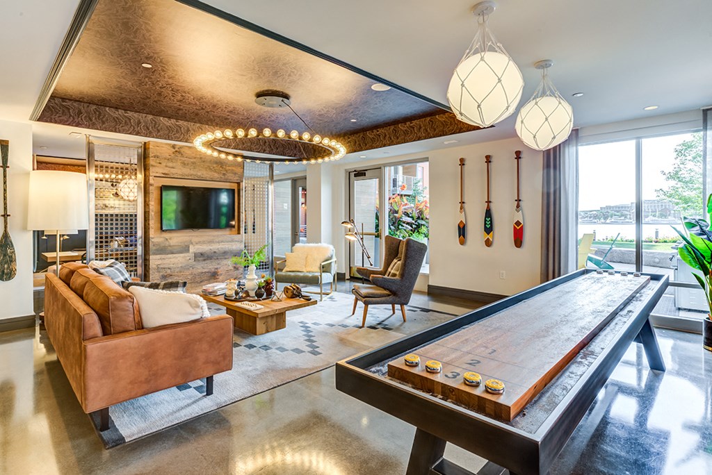 Boston East lobby with furniture and a large flat screen tv