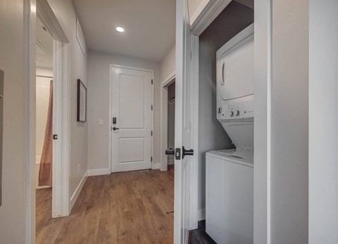 a small laundry room with a washer and dryer