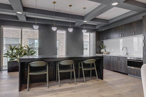 a kitchen with an island and three stools