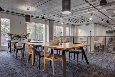 a large dining room with tables and chairs