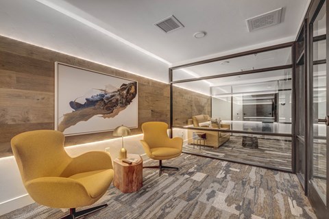 a living room filled with furniture and a large window