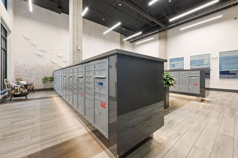 a locker room in a building with wooden floors and a black counter top