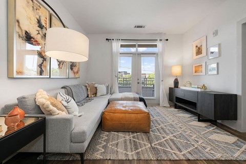 a living room with a gray couch and a