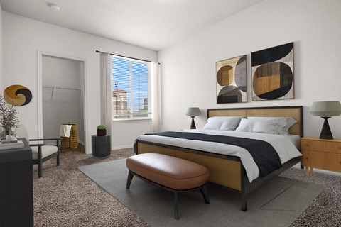 A modern bedroom with a large bed and a large window.