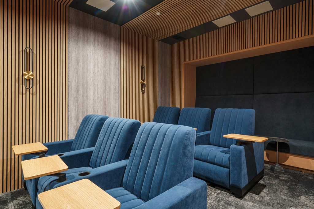 a room filled with blue chairs and tables