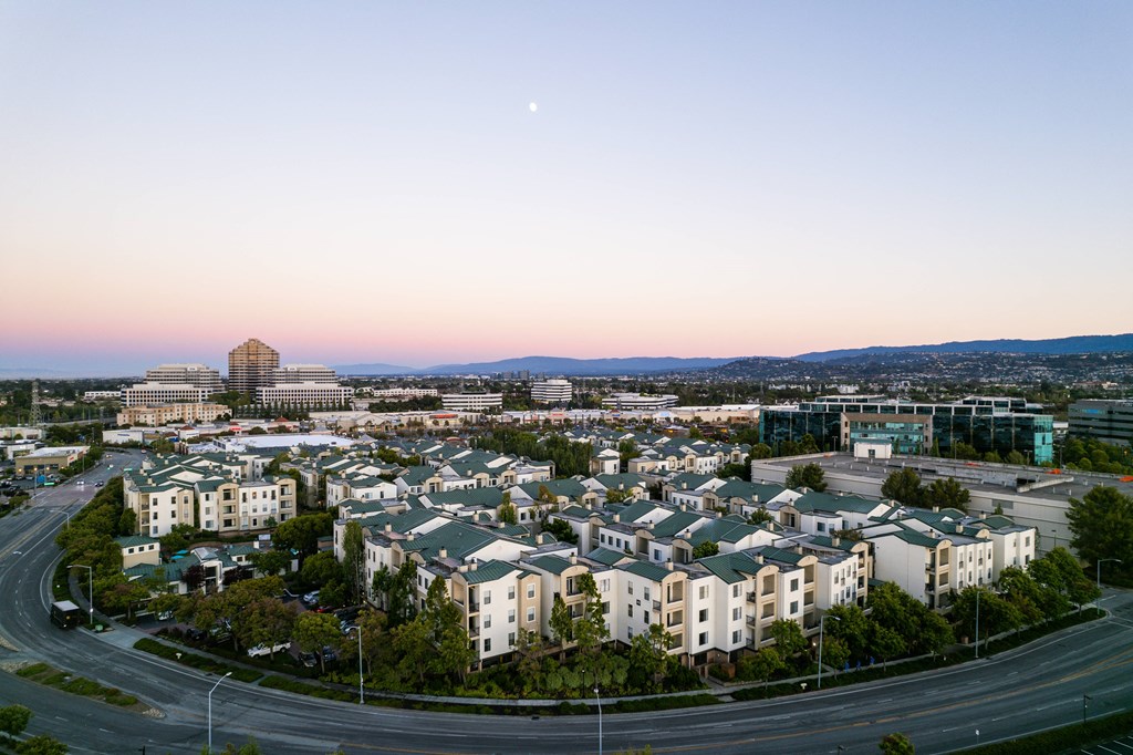 an aerial view of the city at sunset