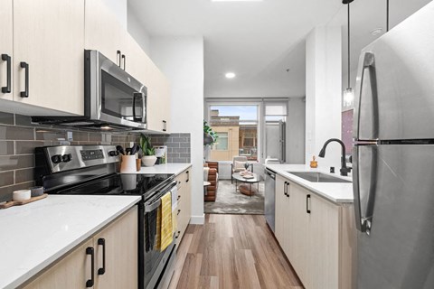 a kitchen with a stove and a microwave