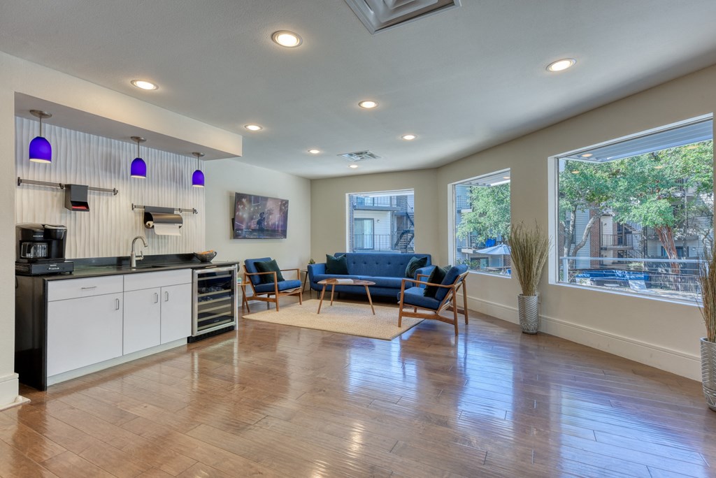 a kitchen and living room with a large window