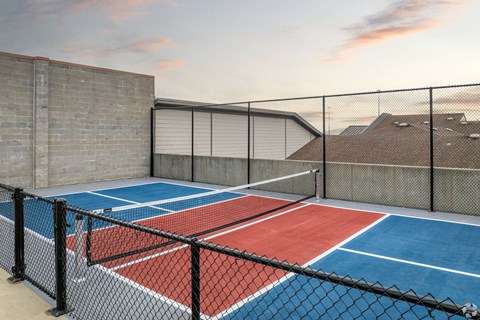 a tennis court on the roof of a building