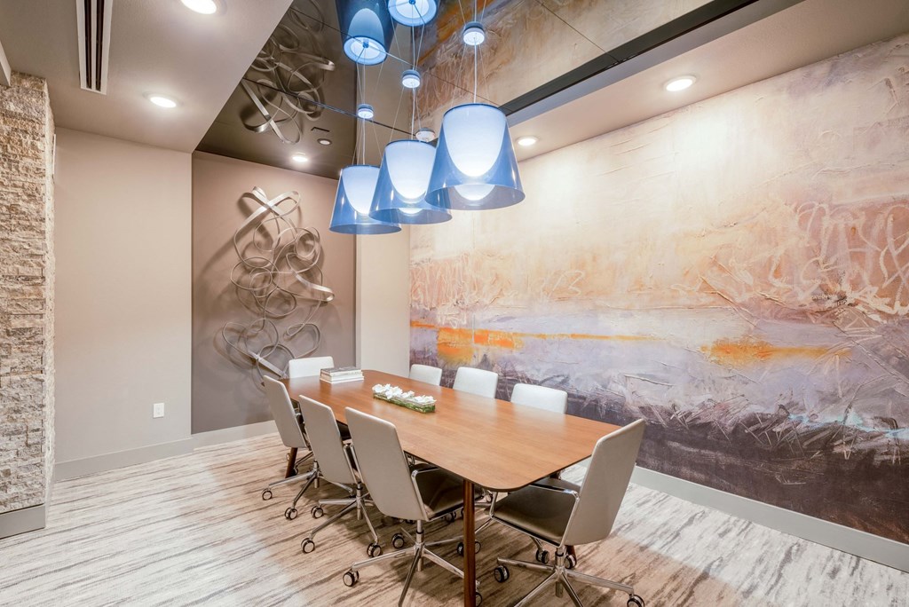meeting room with large table and rolling chairs