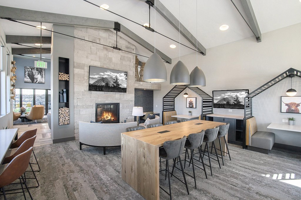 a living room with a fireplace and a dining table