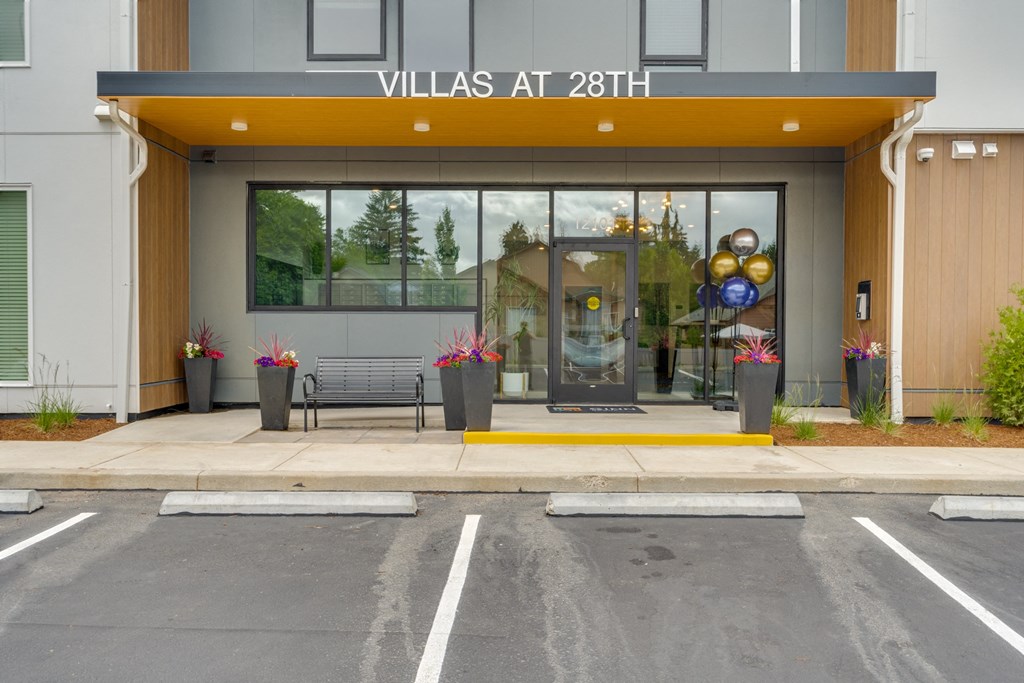 the facade of a villa at 28th street with a glass door and a