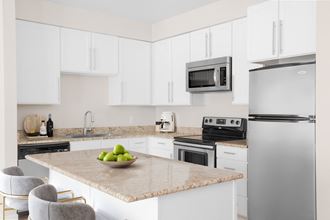 Renovated kitchen with white cabinets
