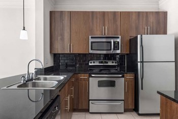 Kitchen showing the island, cabinets, and appliances - Photo Gallery 3