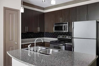 Kitchen showing the island, cabinets, and appliances - Photo Gallery 2