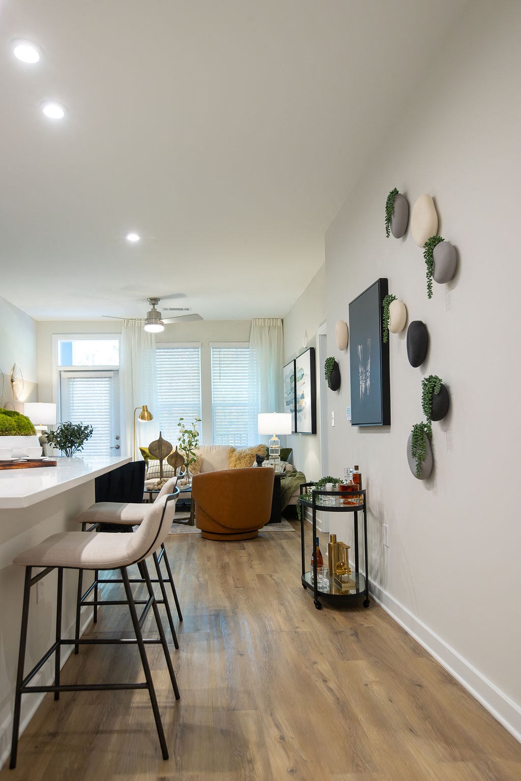 a living room with a couch and a table with chairs