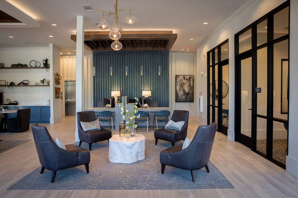a living room with blue walls and a table with chairs