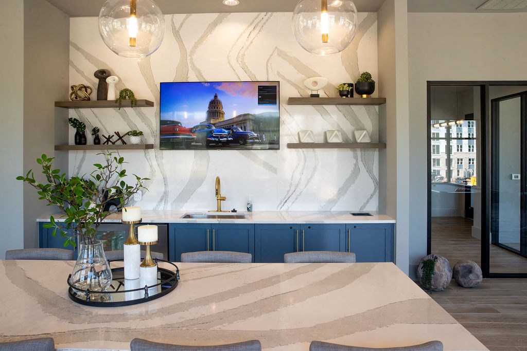 a kitchen or kitchenette with a table and a tv