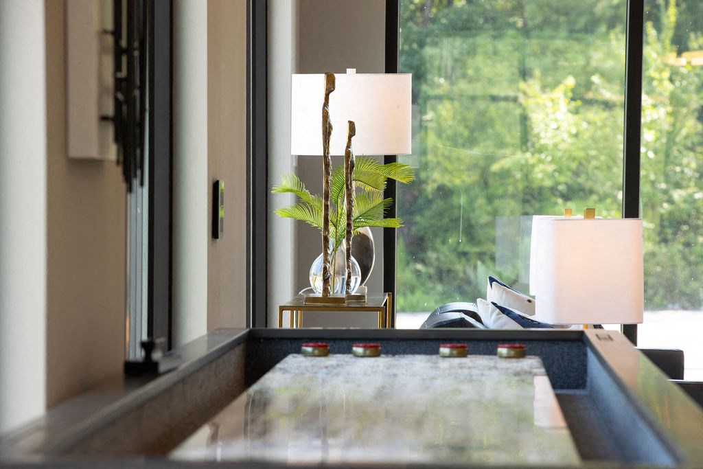 a living room with a table and a window