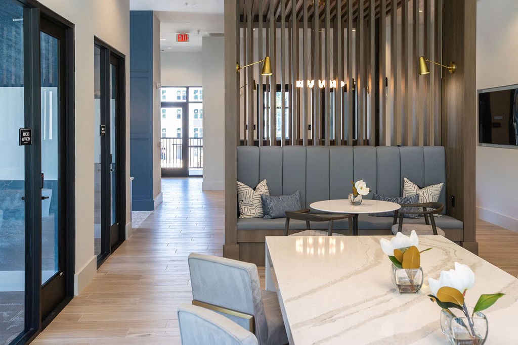 a dining room with a table and chairs