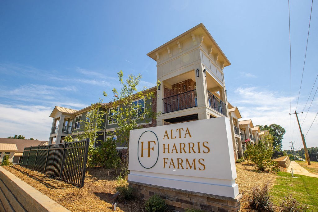 a building with a sign farms