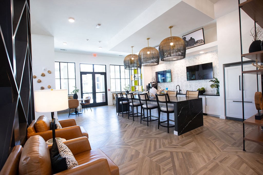 a living room with a kitchen and a dining room