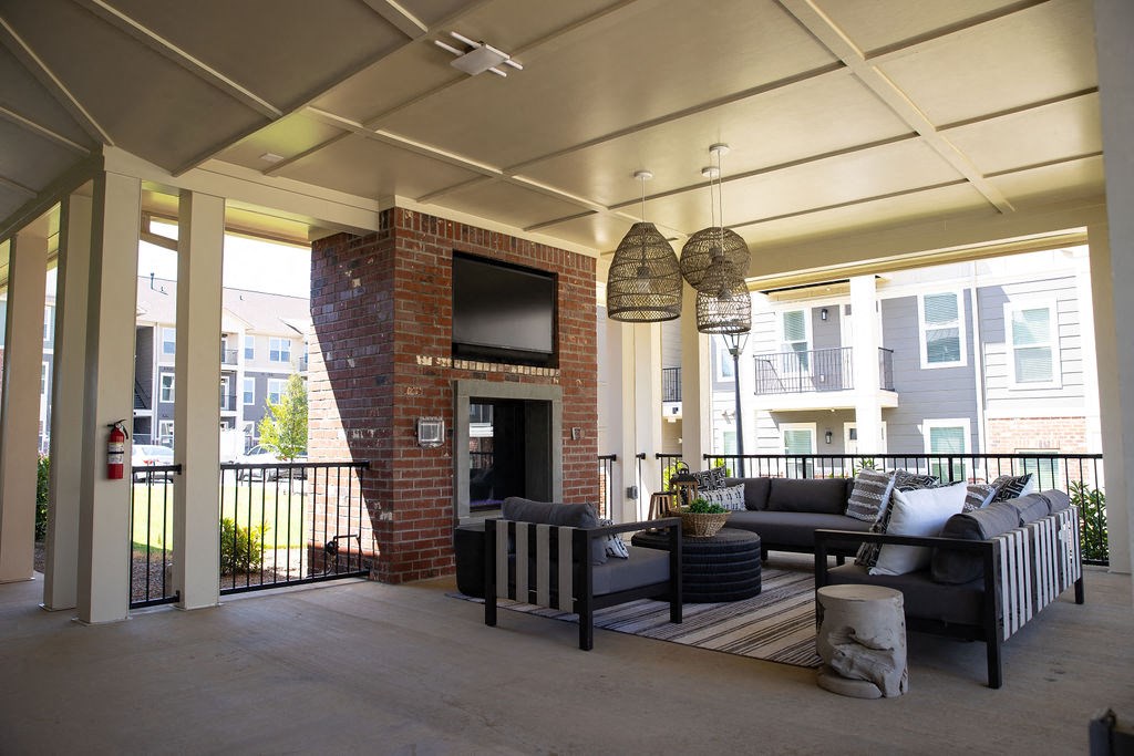 a large living room with couches and a fireplace