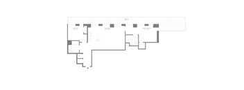 A floor plan of a building with multiple rooms and corridors.