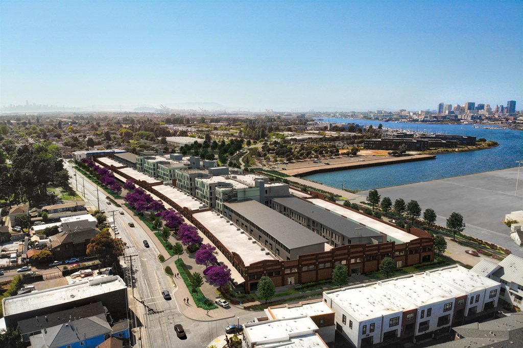 an aerial view of a city with a river and buildings