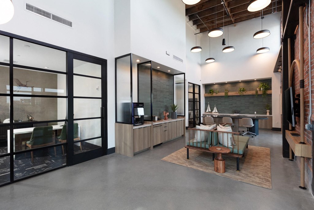 the lobby of a restaurant with a reception desk and a table with chairs