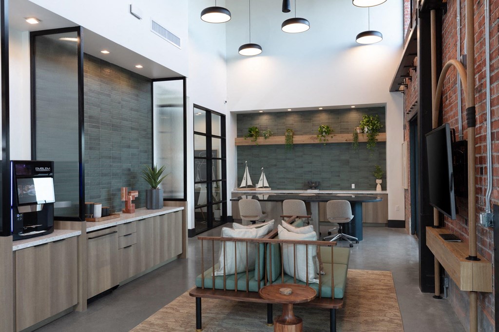 a lobby with a table and chairs and a television
