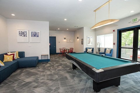 a living room with a pool table