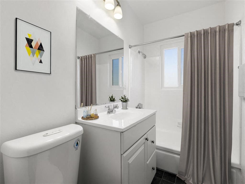 a bathroom with a sink toilet and shower at Pacific Rose, Los Angeles, CA