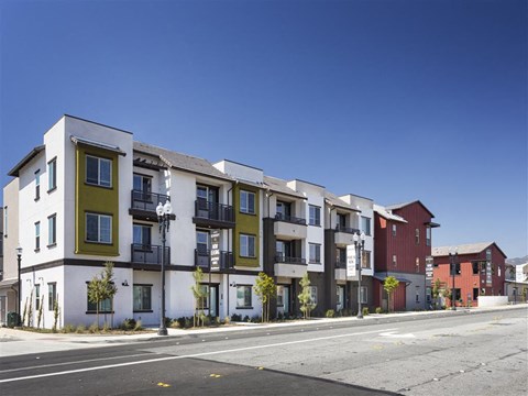 a row of apartment buildings on a city street