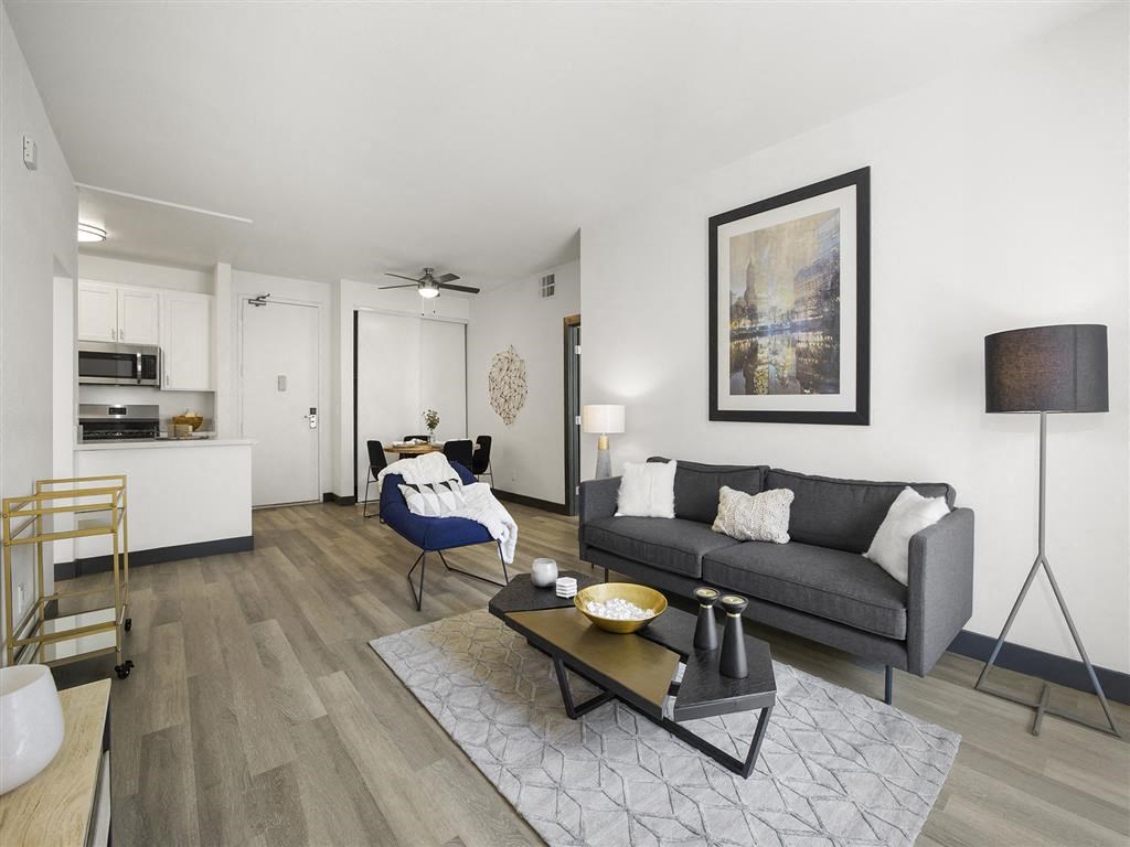 a living room with a couch and a table at Enclave, Paramount, CA 90723