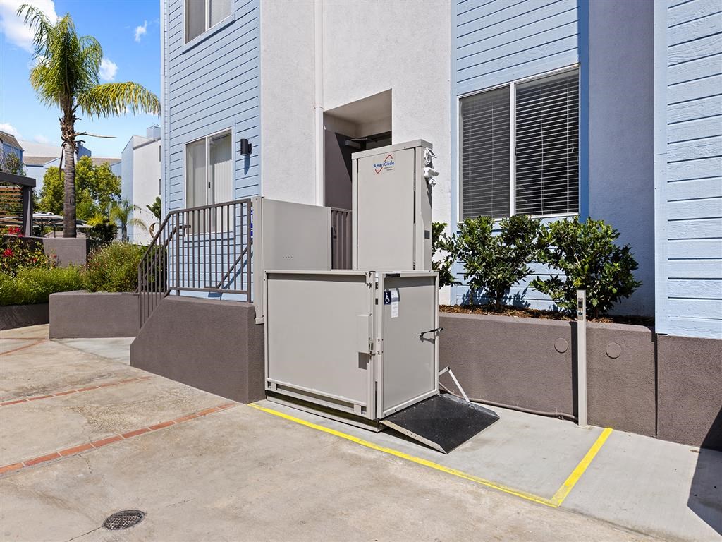a white refrigerator freezer sitting in front of a building at Enclave, California, 90723