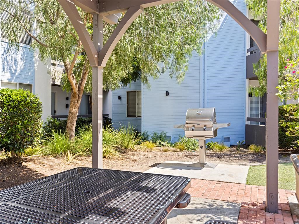 our apartments in a city have a picnic table and grill at Enclave, Paramount, CA 90723