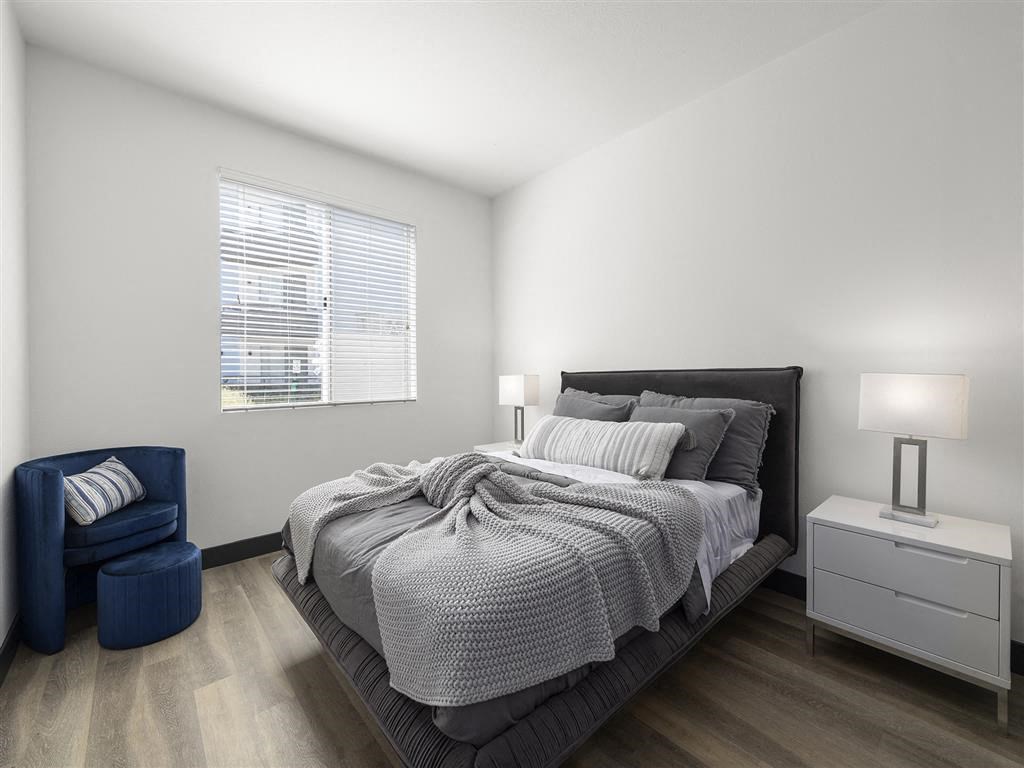 a bedroom with a large bed next to a window at Enclave, Paramount, 90723