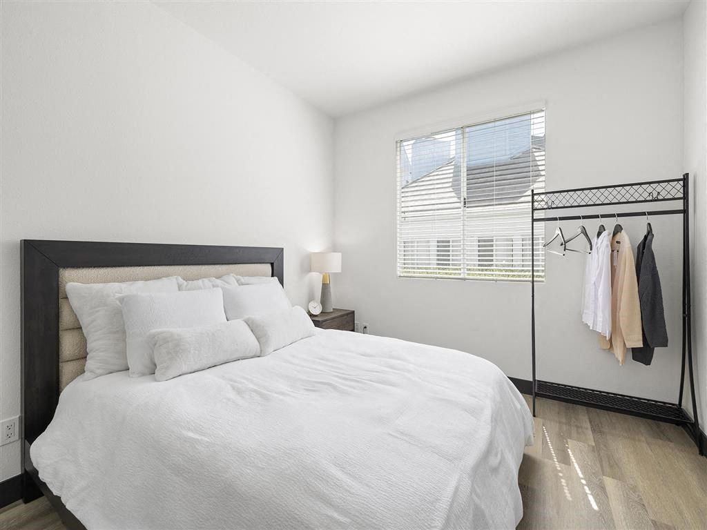 a bedroom with a large bed and a closet a bedroom with a large bed and a closet at Enclave, California