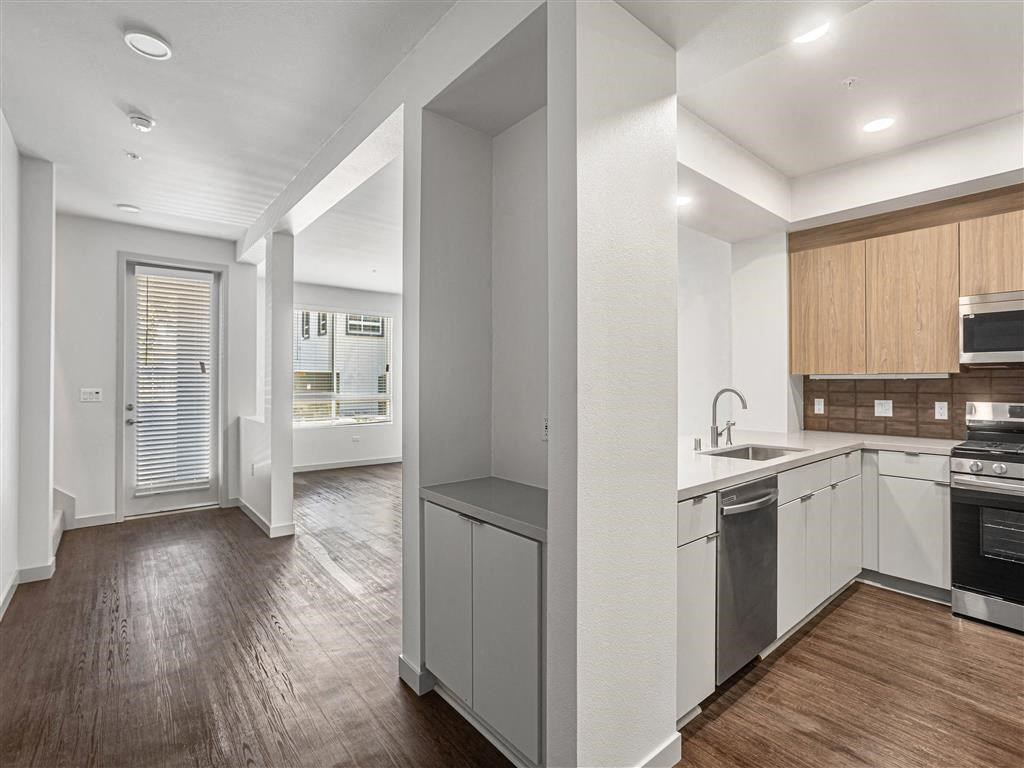 a kitchen with a sink and a stove in a house