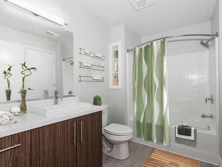 a bathroom with a toilet sink and a shower