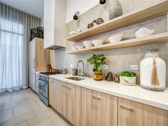 a kitchen with a sink and a stove