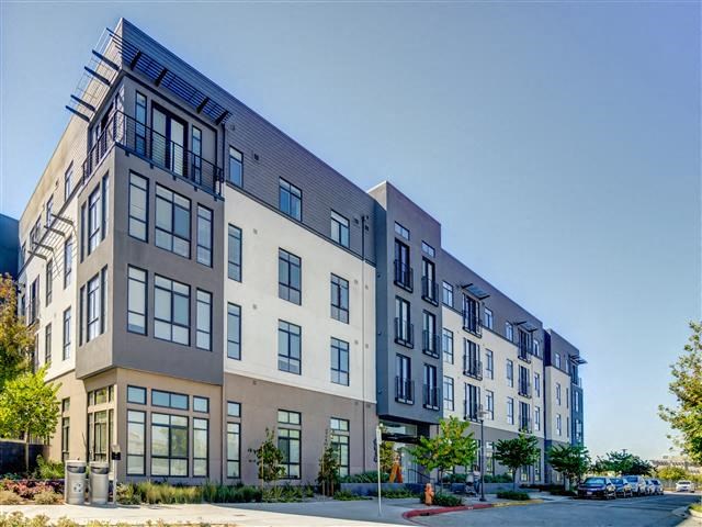 a tall building with a street in front of it