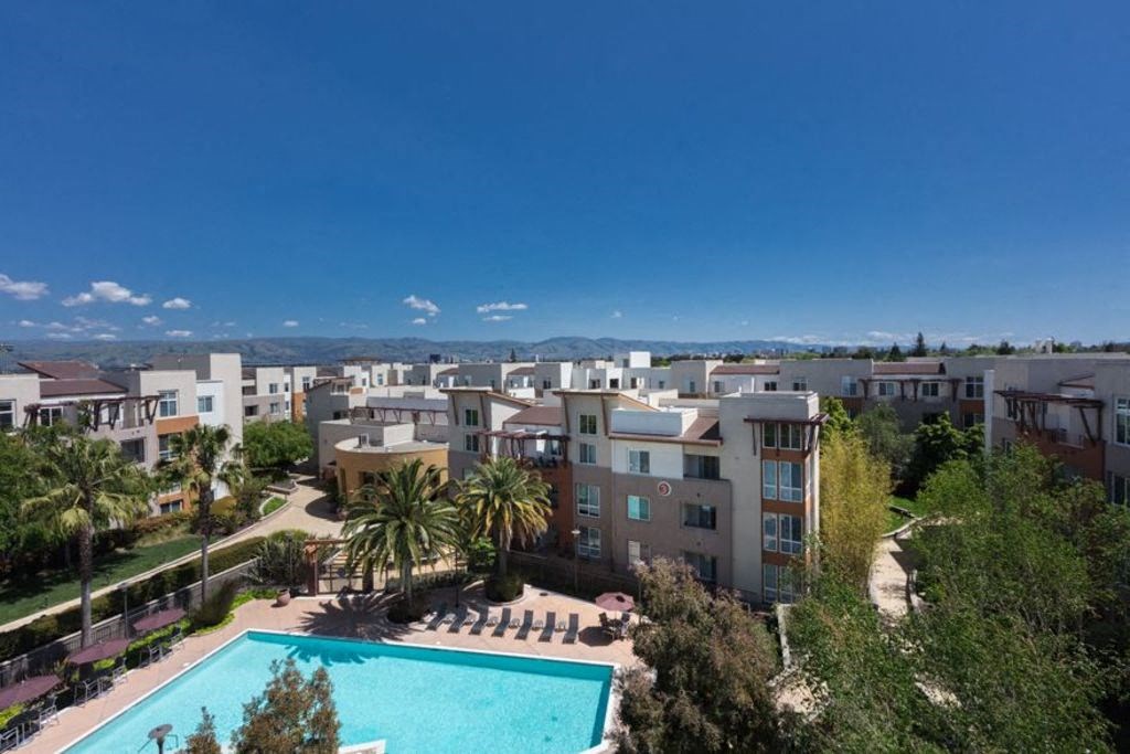 aerial exterior shot overlooking city and pool deck