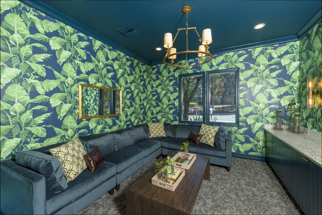 a living room with blue couches and a coffee table