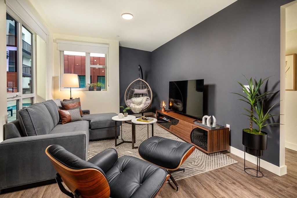 a living room with a couch and a tv